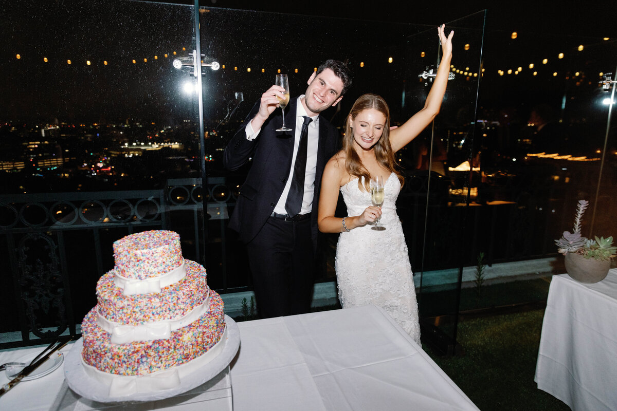 bride-and-groom-cut-the-cake-at-the-london-west-hollywood