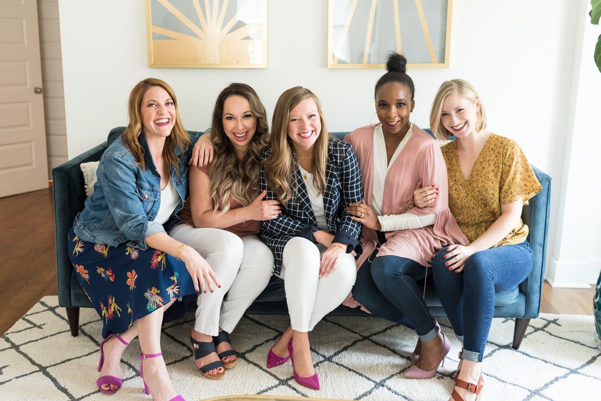 Fun headshot for a group of women business owners in Nashville sitting on a couch together