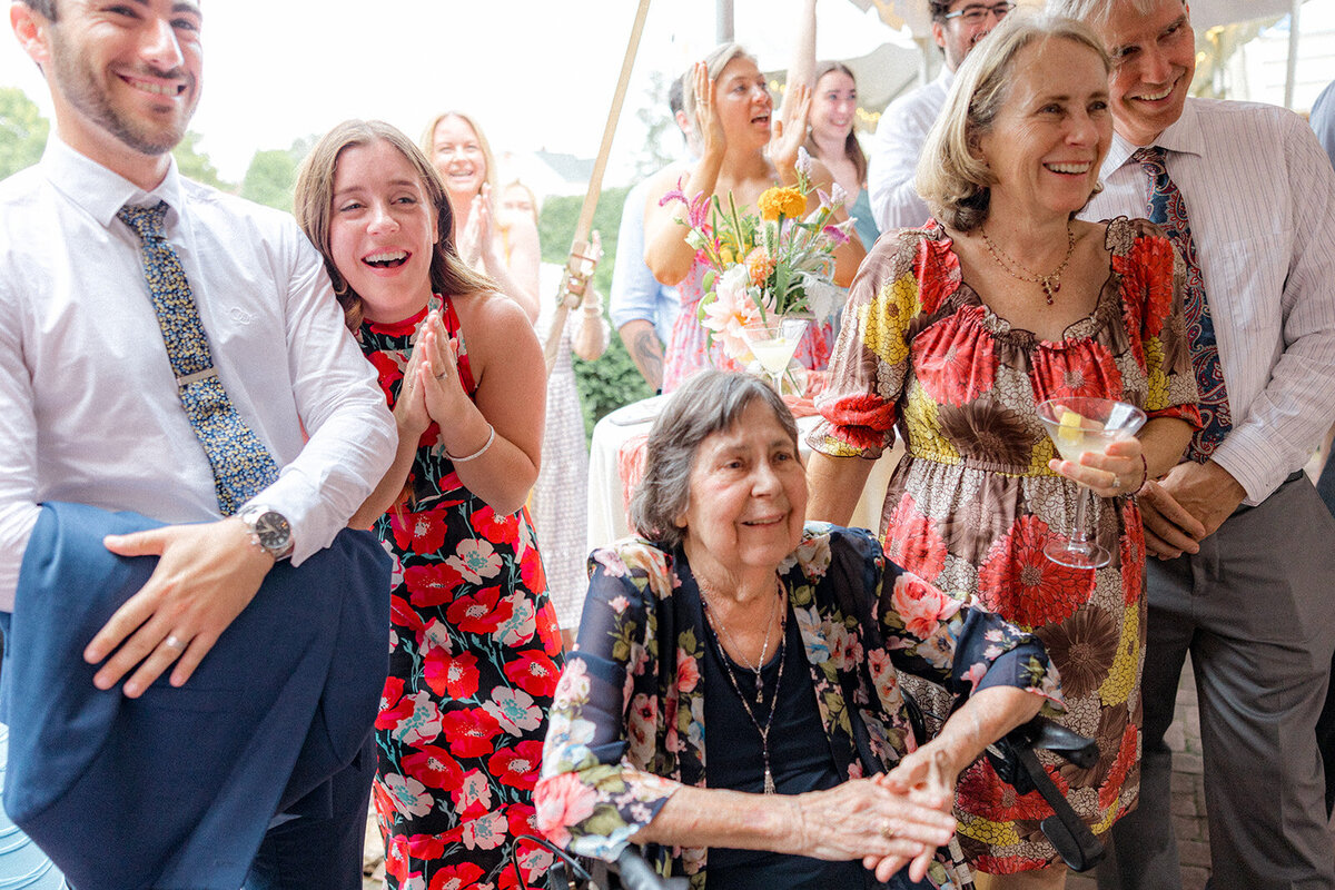 Wedding guests smiling and clapping