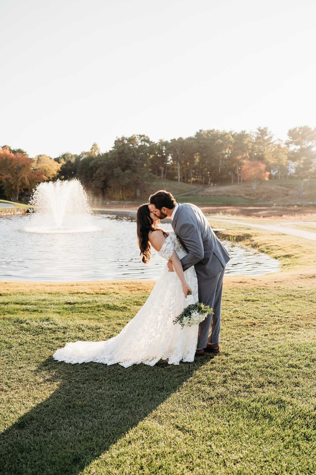 Bride and groom celebrating after their ceremony in golden hour light. Venue is Willowbend Cape Coed Massachusetts