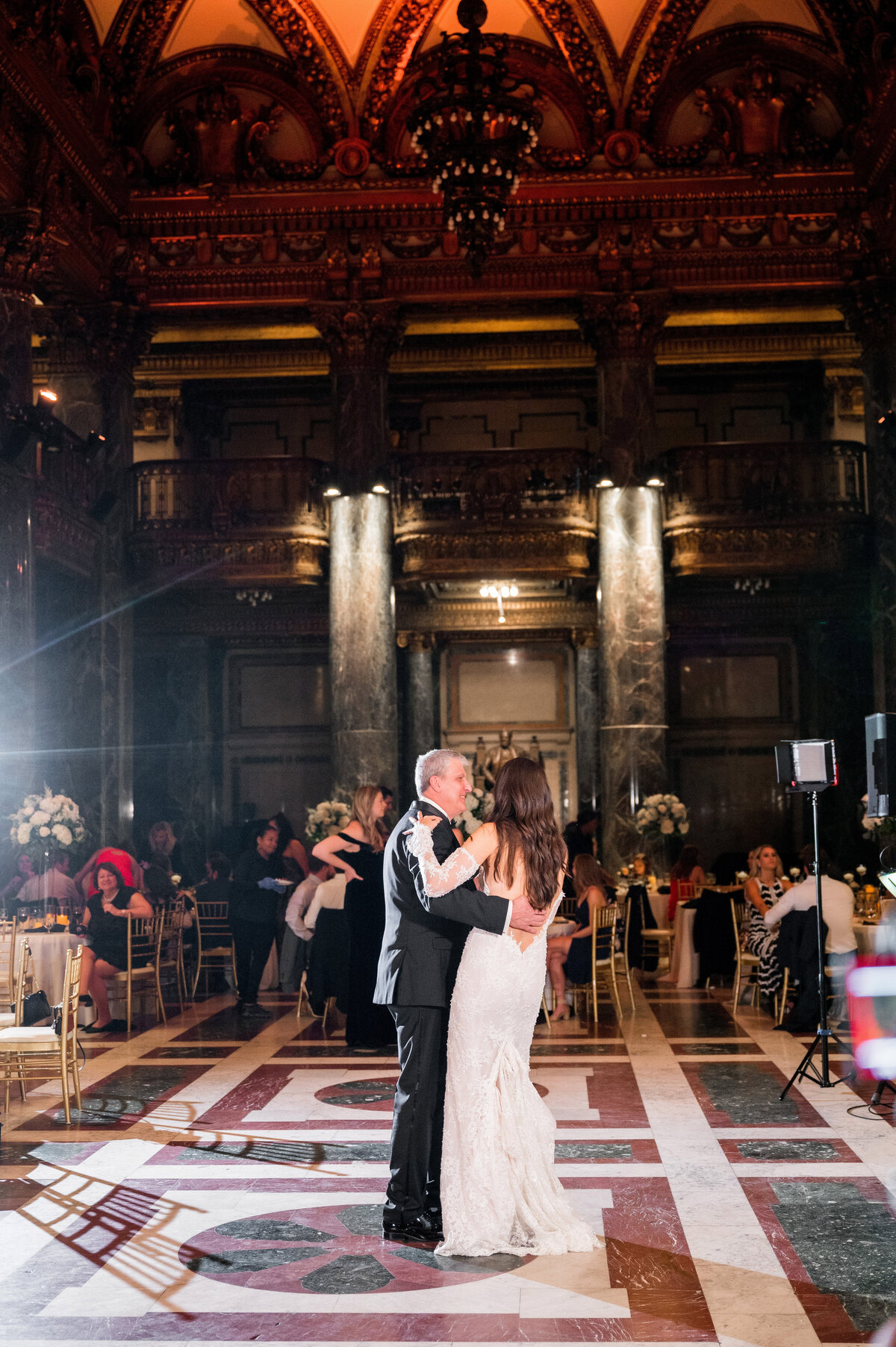 bride and dad dancing in music foyer