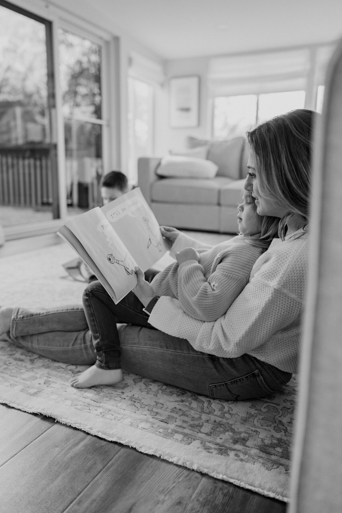 Mom reading to her daughter