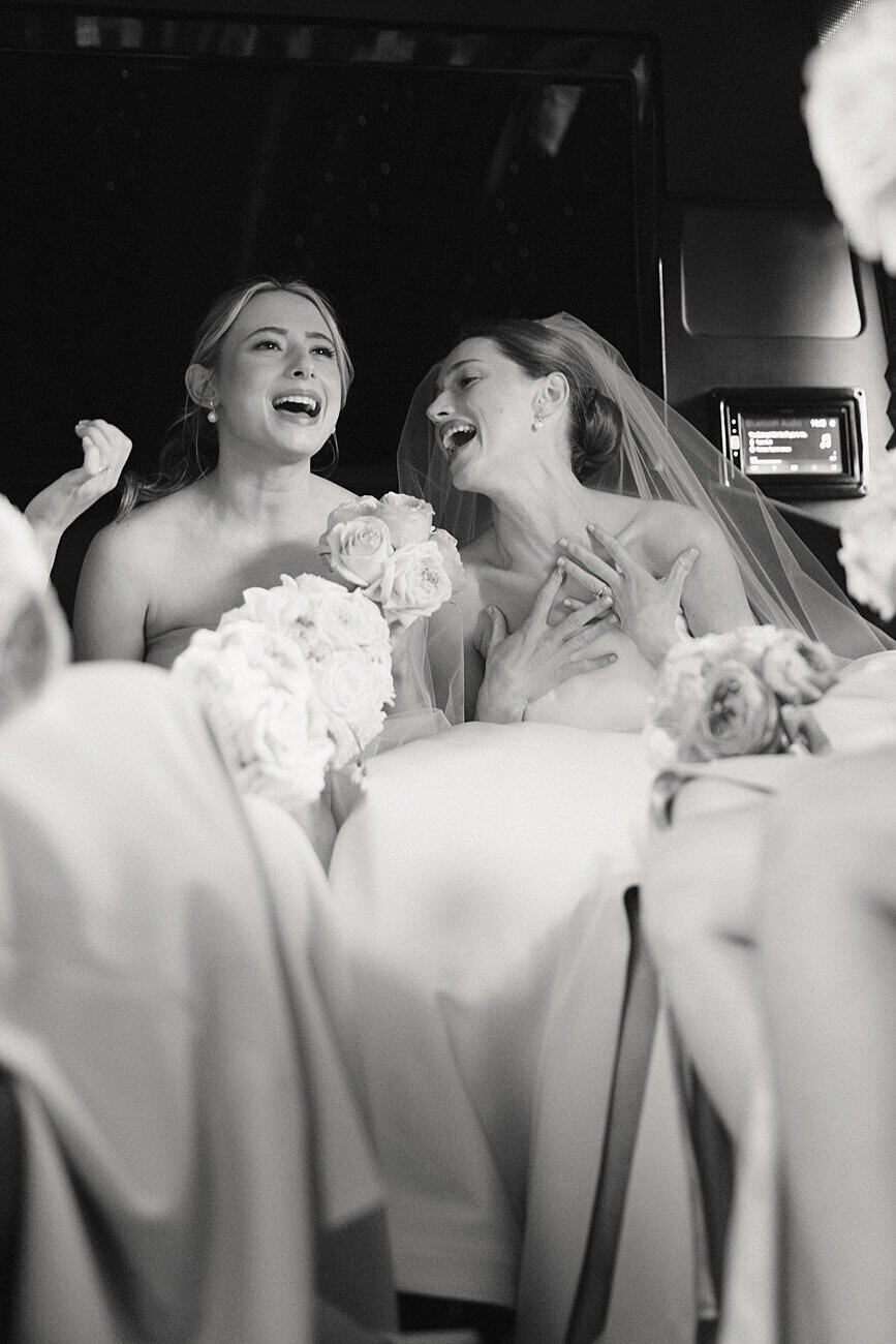 bride and her sister singing on party bus