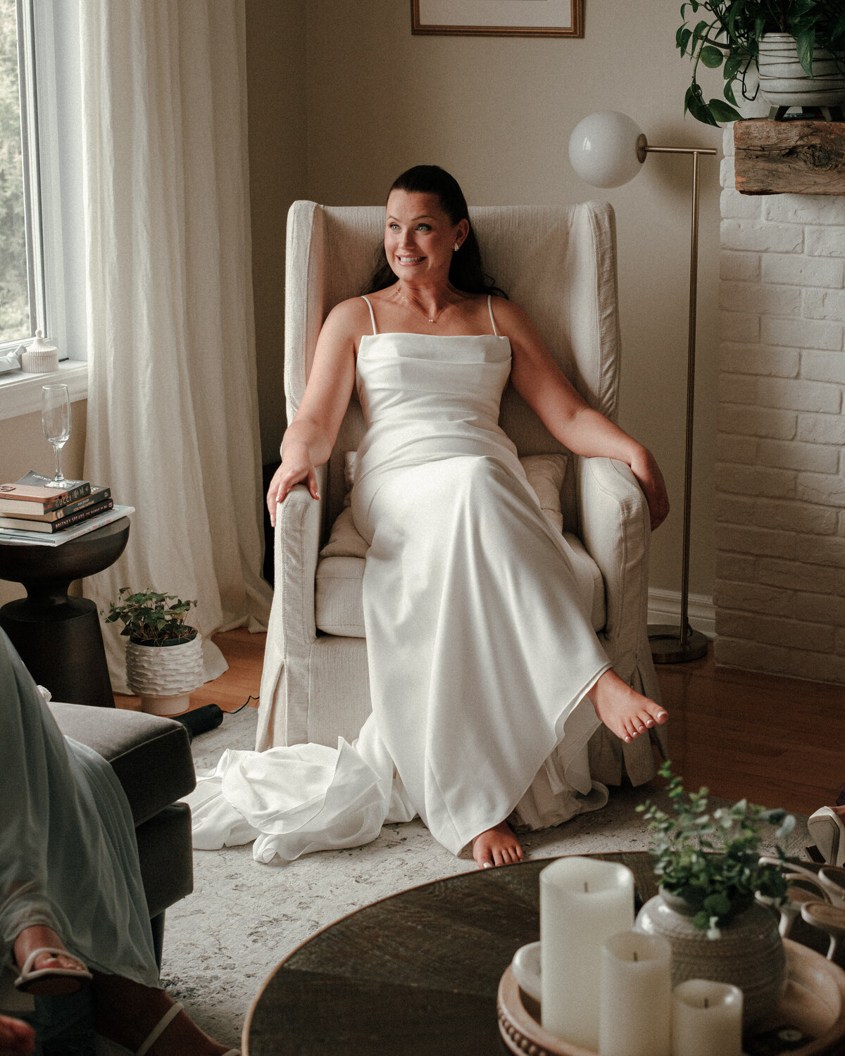 soon to be wife shares a fun and nervous smile in her living room