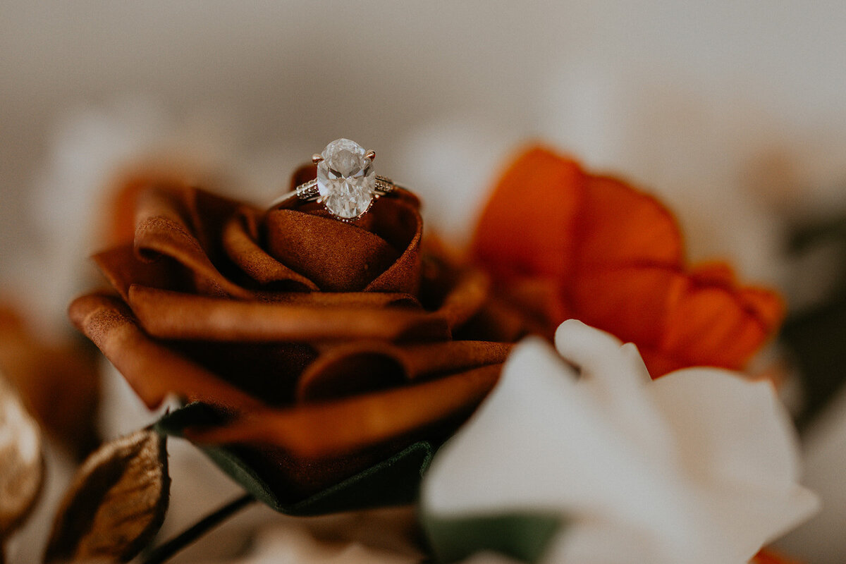 brides ring sitting on a flower