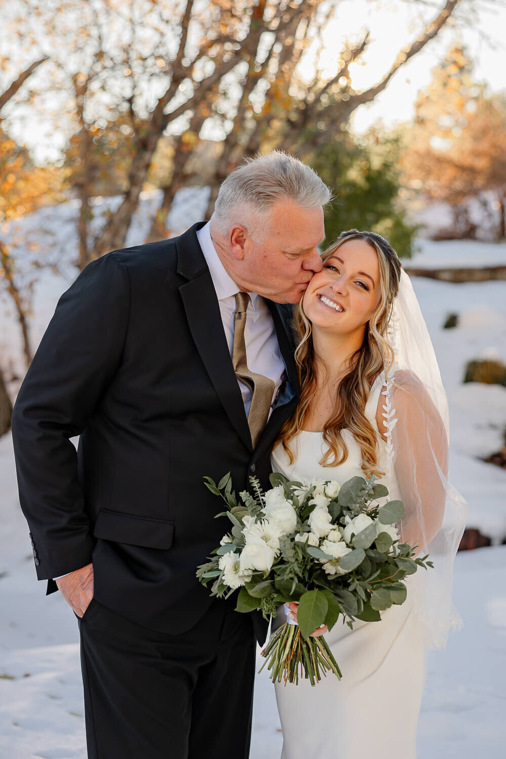 Heartwarming moment between the bride and her father during a wedding in Colorado Springs, captured by Michelle Betz Photography