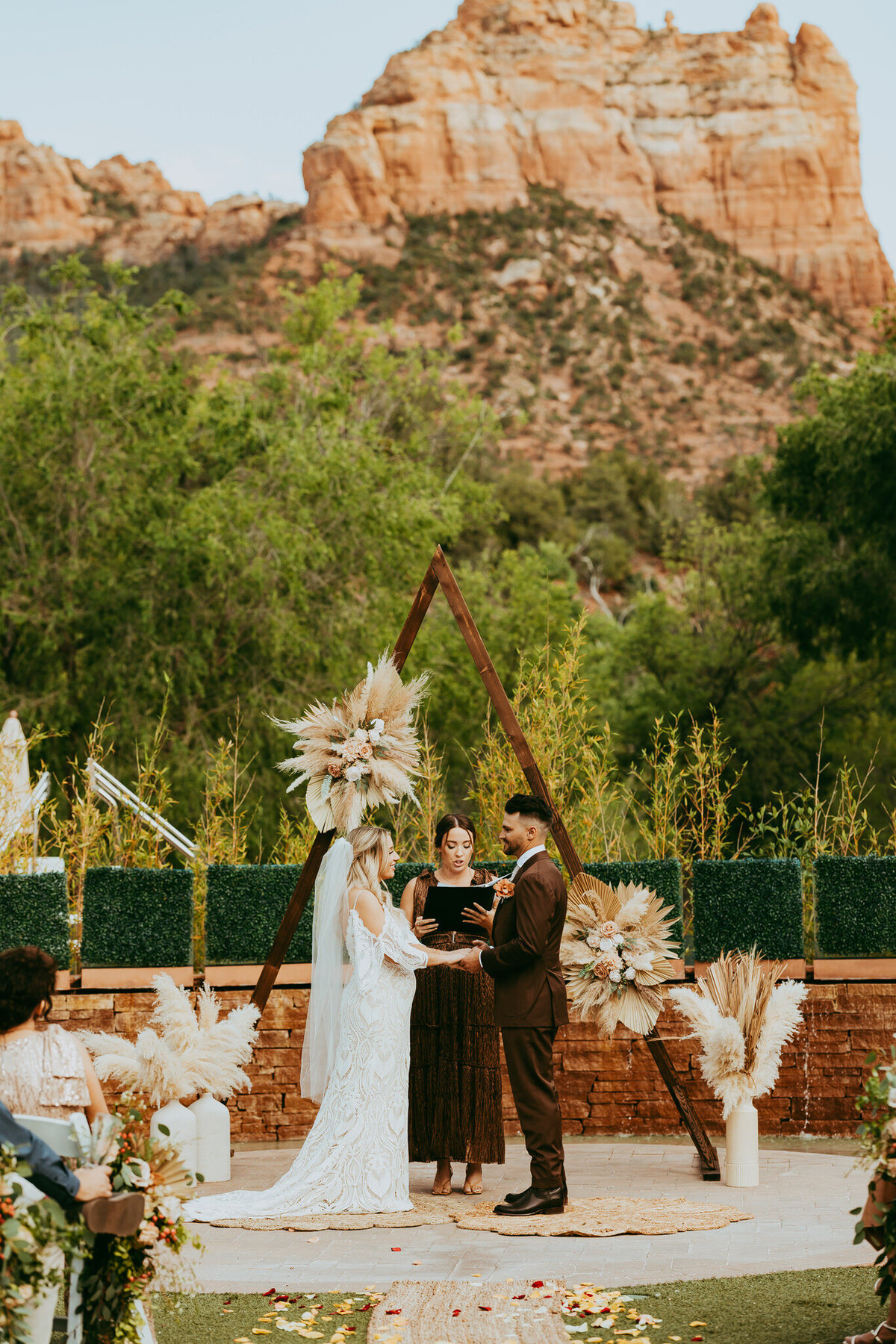 bridal couple stands at alter at amara resort in sedona