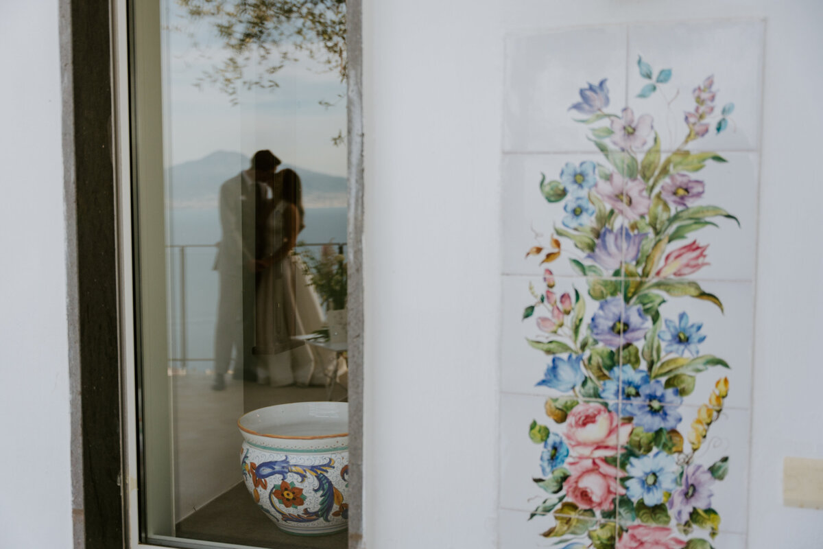 Friends celebrating with champagne on terrace