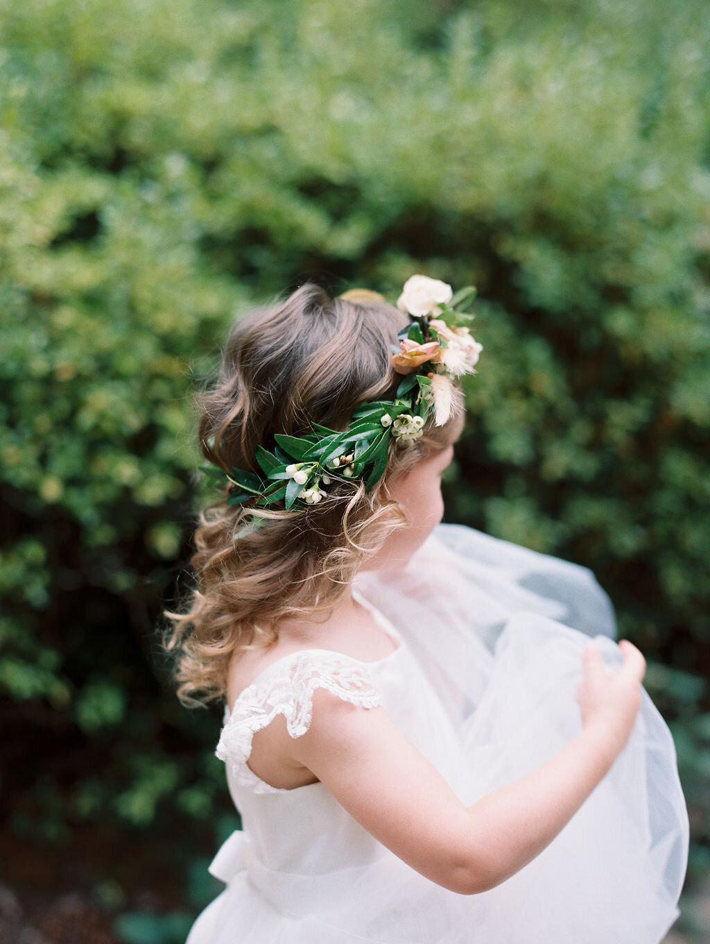 Flower girl crown featuring natural greenery, roses and wax flower. Nashville wedding florist at RT Lodge. Design by Rosemary and Finch in Nashville, TN.