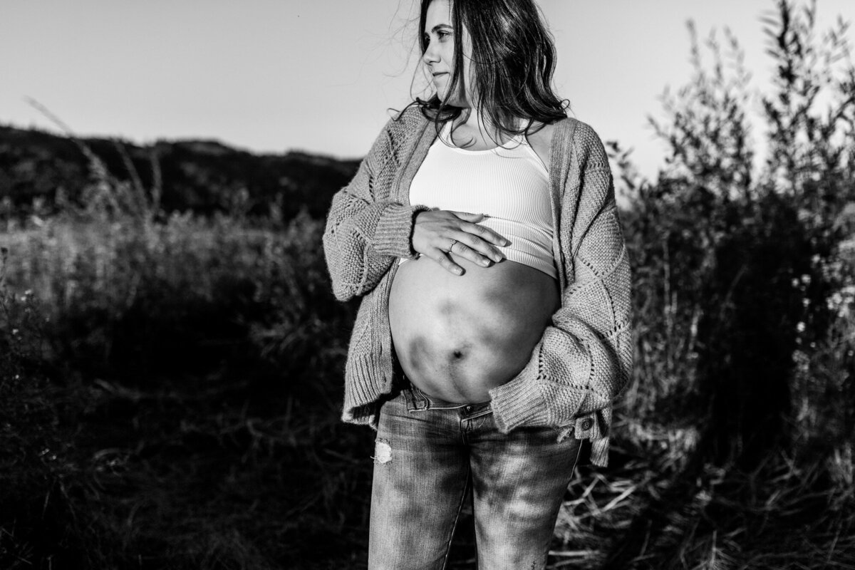 Black and white image of pregnant woman in the Columbia River Gorge.