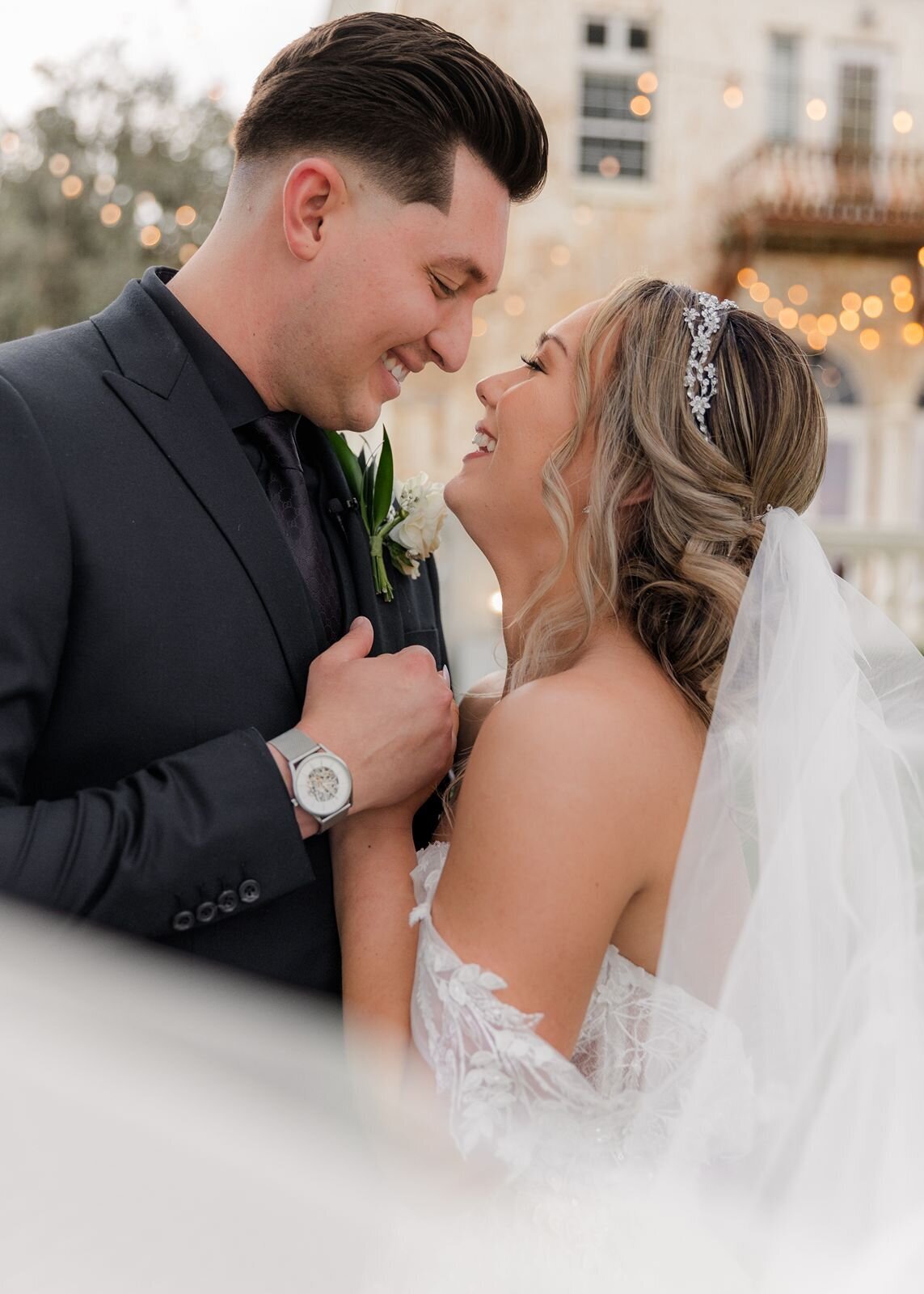 Bride and Groom smiling at each other at Bella Cosa, Lake Wales, Florida