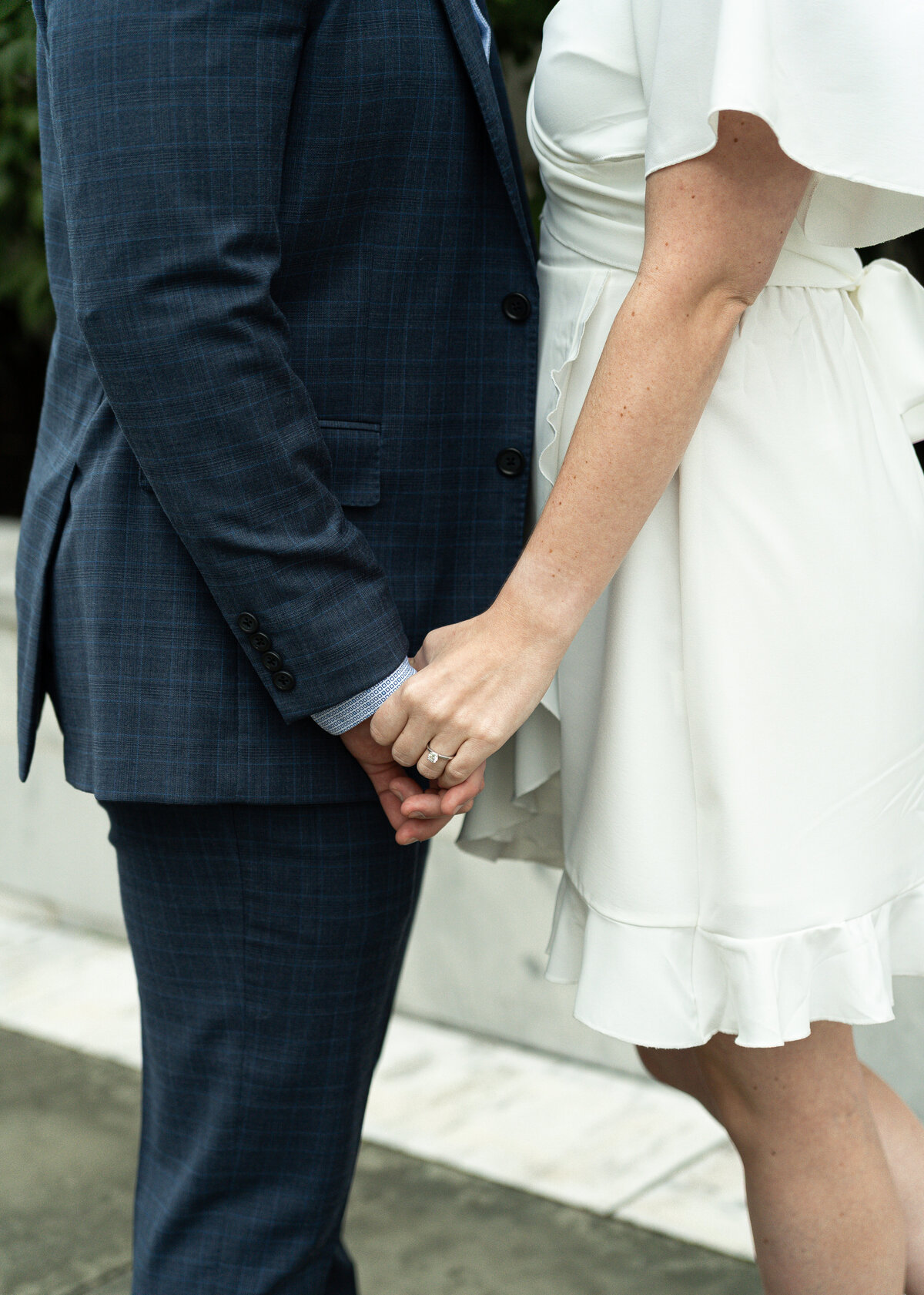 couple holding hands in soft evening light at Cleveland Museum of Art