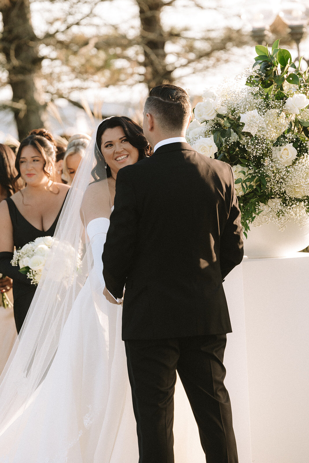 A bride and groom at the alter during their ceremony