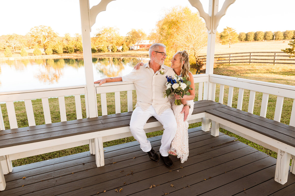 Couple sitting together on bench during their elopement