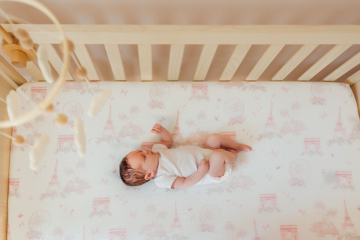 baby in crib long island newborn photography