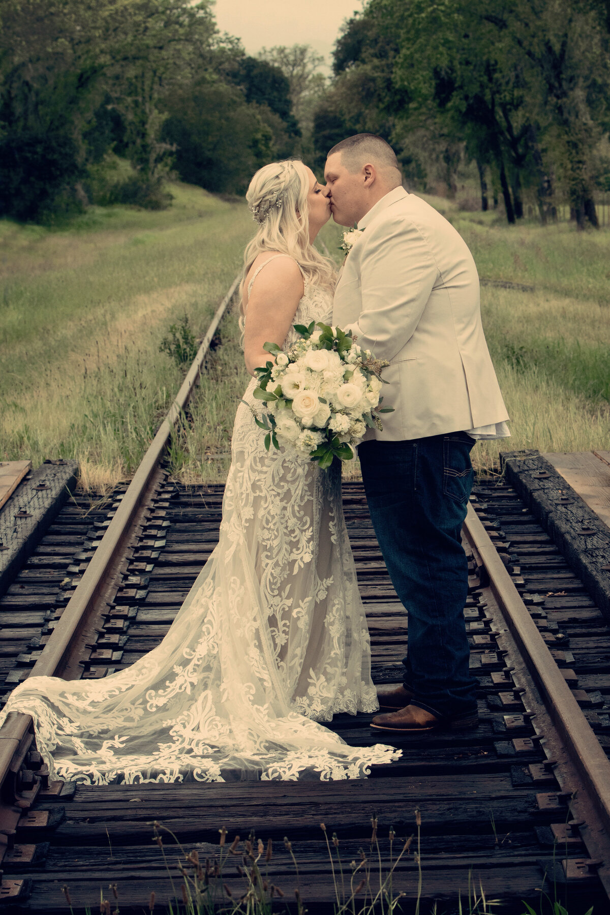 Bride and groom Red Barn Ranch on Railroad tracks