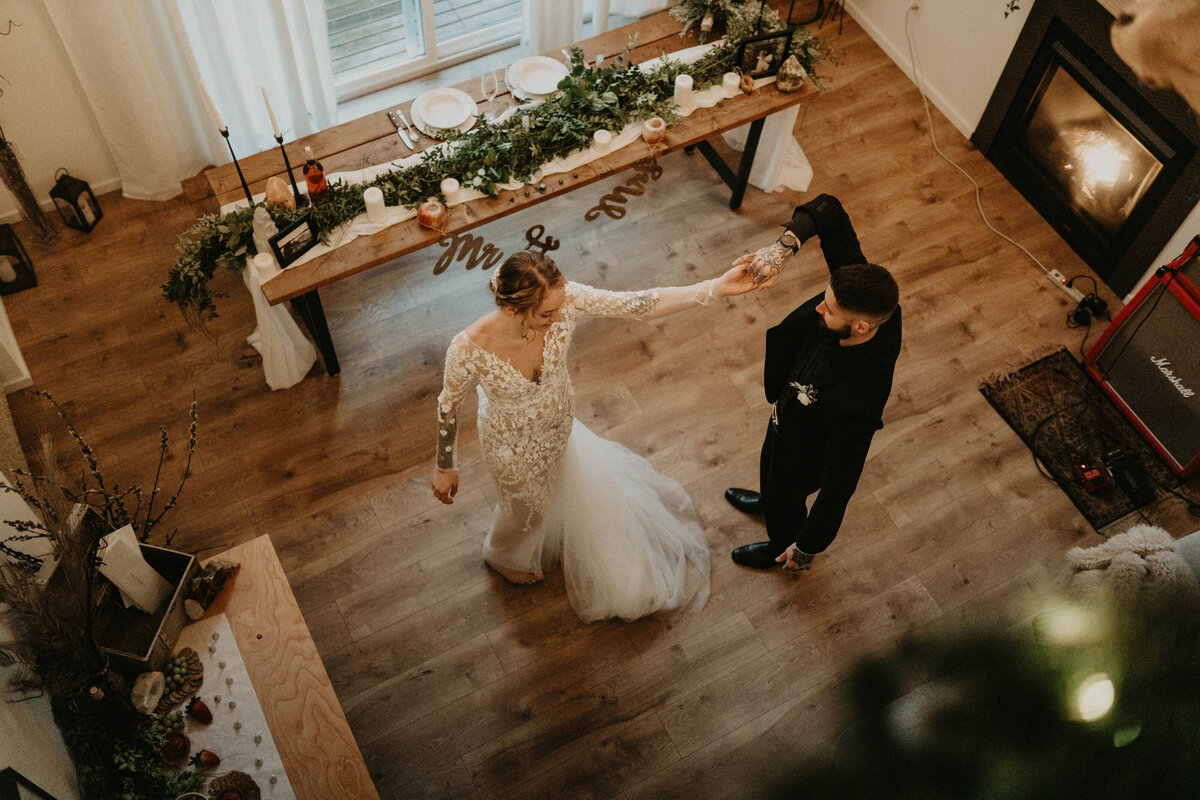 Bride and groom sharing a first dance in their cabin near Mt Rainier after their elopement