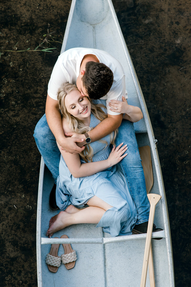 couple in canoe kissing