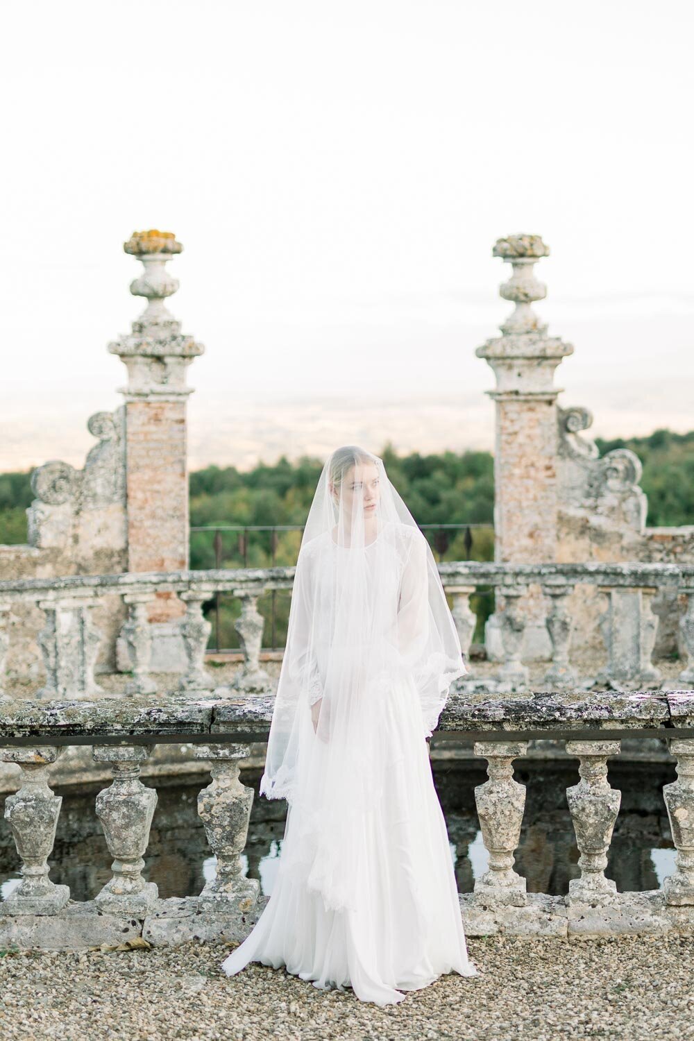 bride standing in garden in castello di celsa