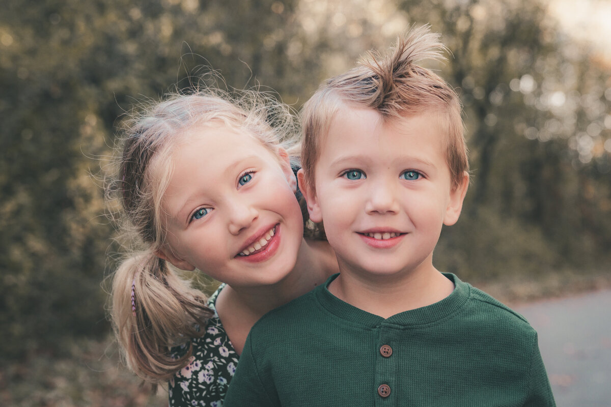 a beautiful photo of a brother and sister taken by a family photographer at bicentennial park in Grand Blanc, MI 