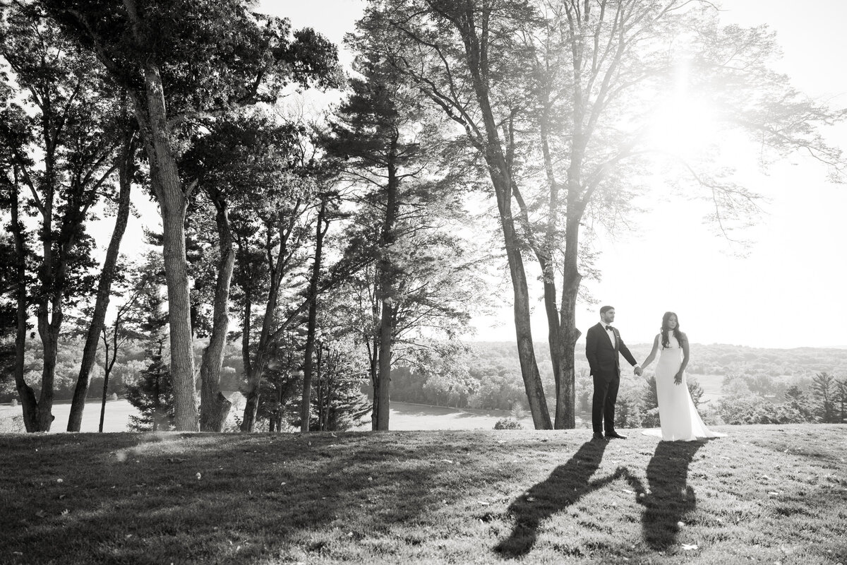 bride and groom behind the pendry natirar mansion