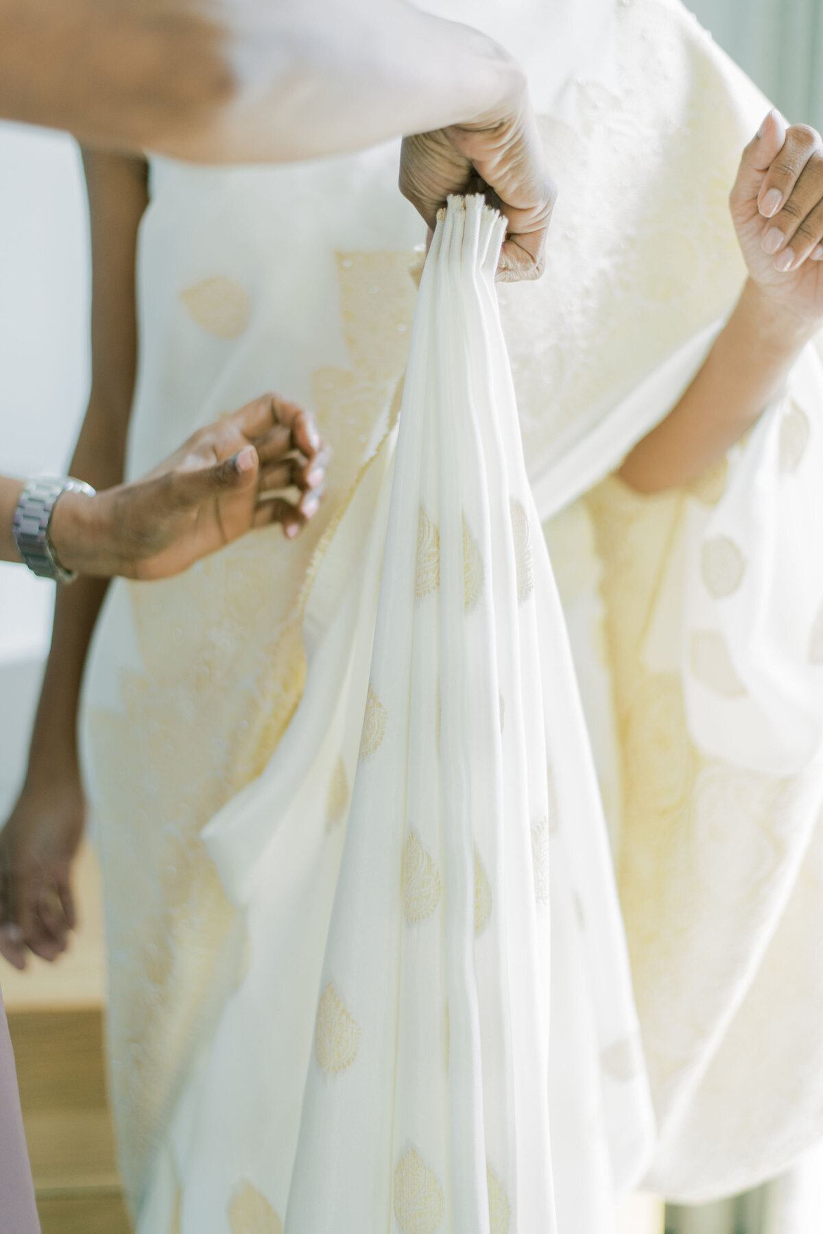 Details on the dress while getting dressed at the pearle hotel