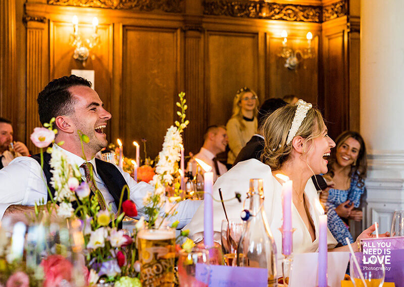 Bride and groom laughing 624