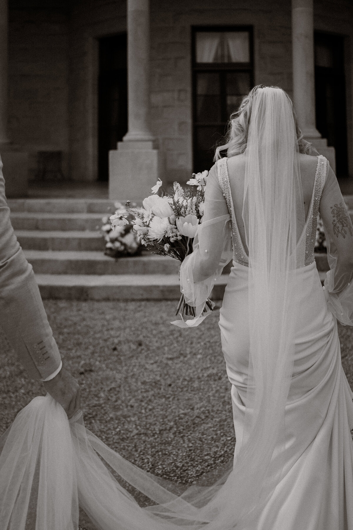Bride walking with flowers