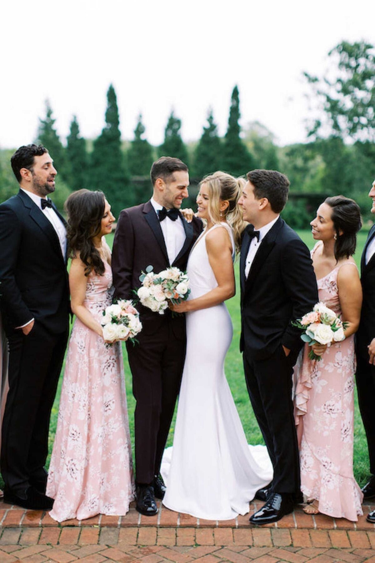 Classic and Bohemian wedding party portraits at a luxury Chicago outdoor garden wedding.