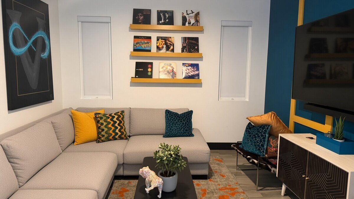 LightGuard 360 blackout shades on two windows in a Summerlin media room with a large TV