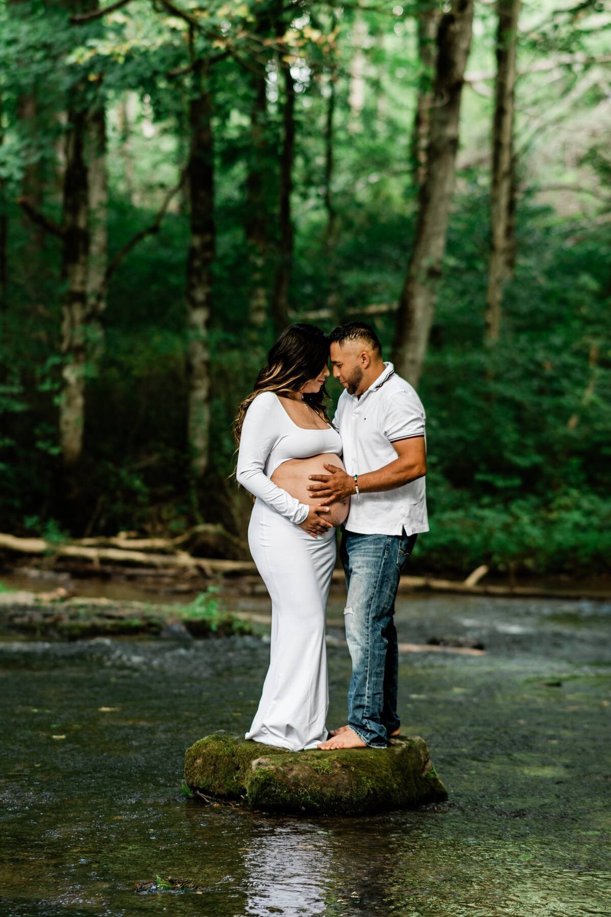 Maternity couple in the forest