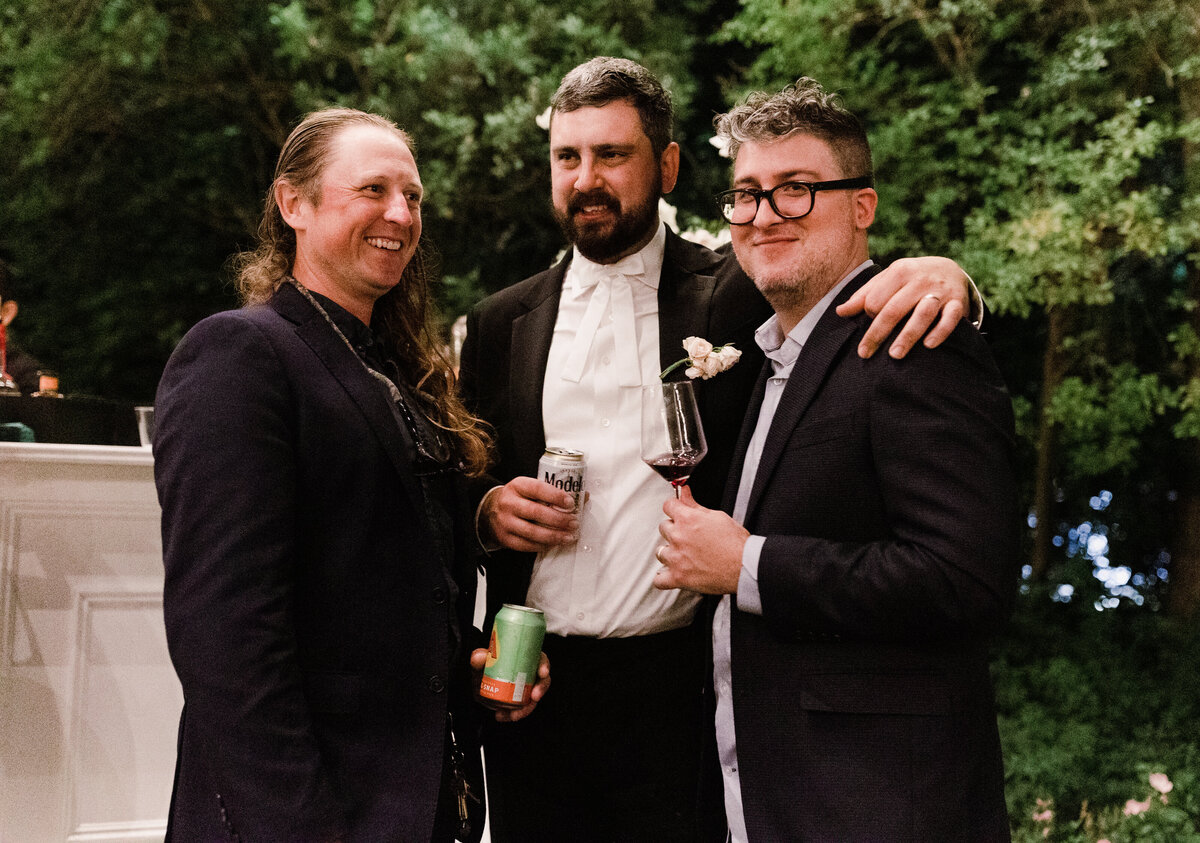 Men at wedding reception at Umlauf Sculpture Garden, Austin