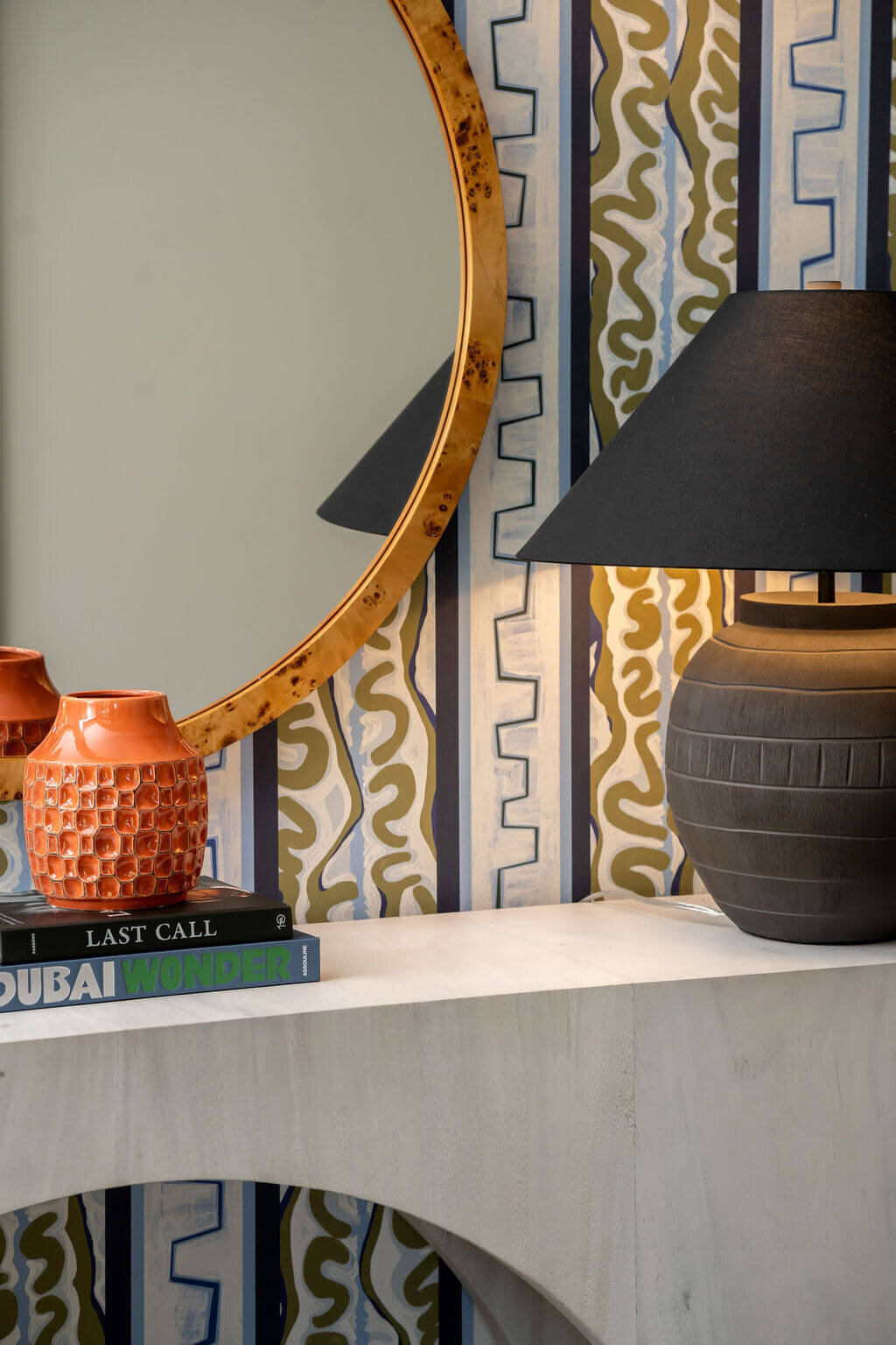 sweet southern home mid mod books vase and lamp on accent table