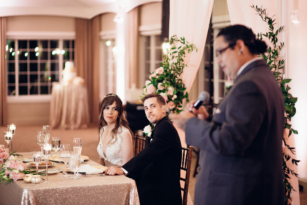 Wedding Photograph Of Bride And Groom Looking At The Man in Gray Suit Los Angeles