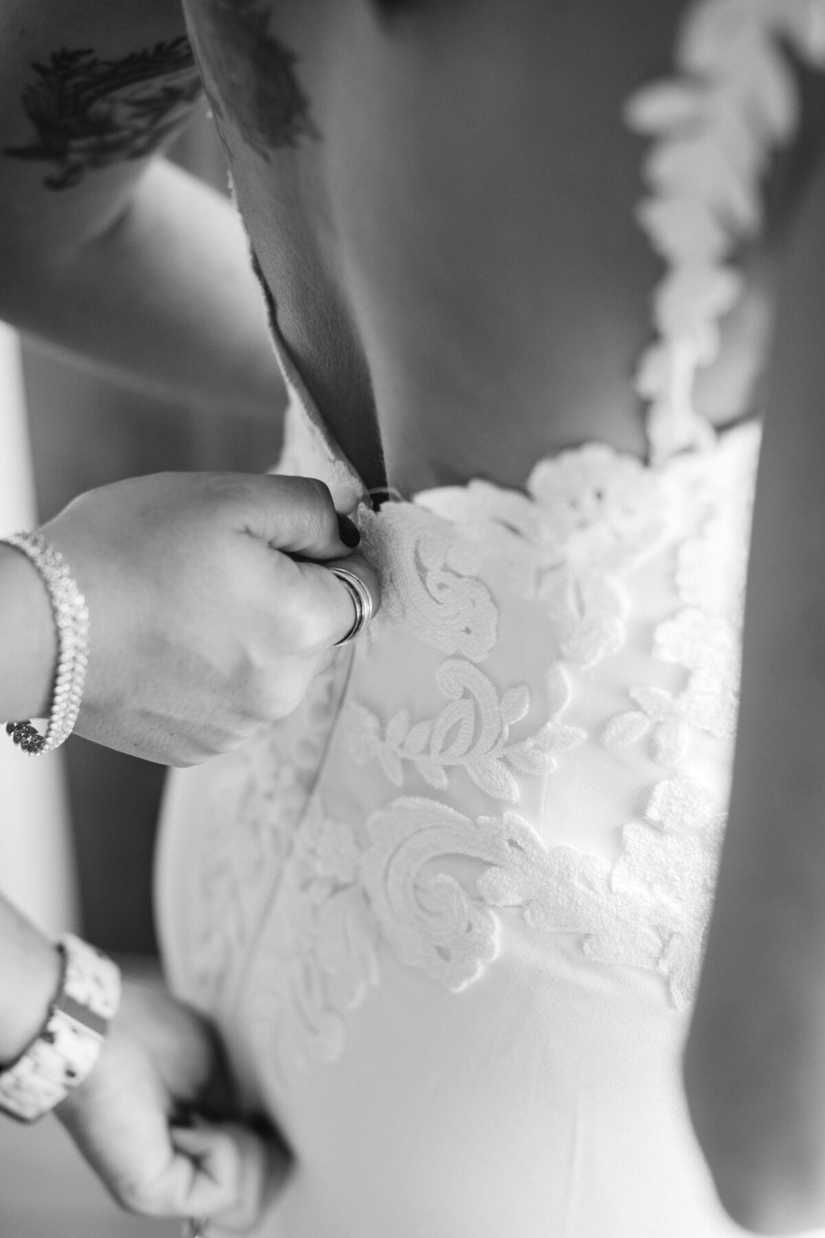 bride getting into dress for Wedding in Franconia New Hampshire