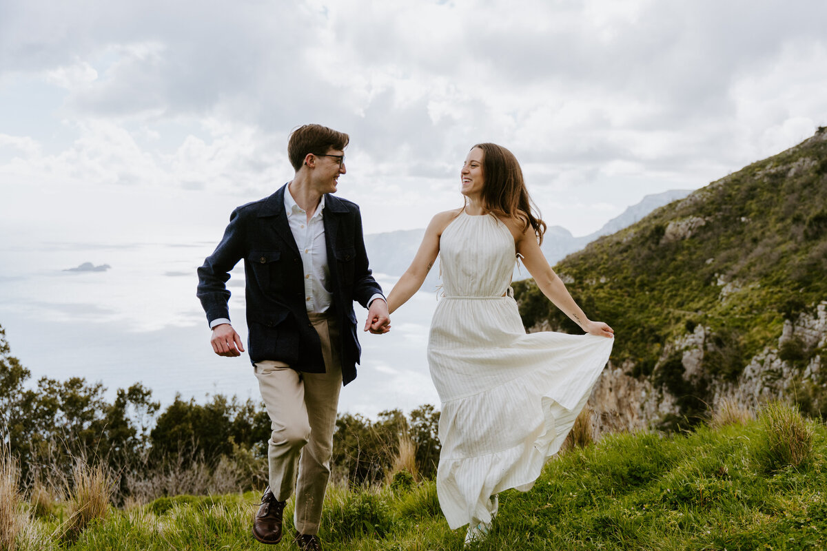 Couple running on a trail together.