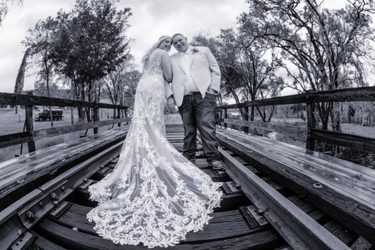 Red Barn Ranch Bride and groom railroad tracks