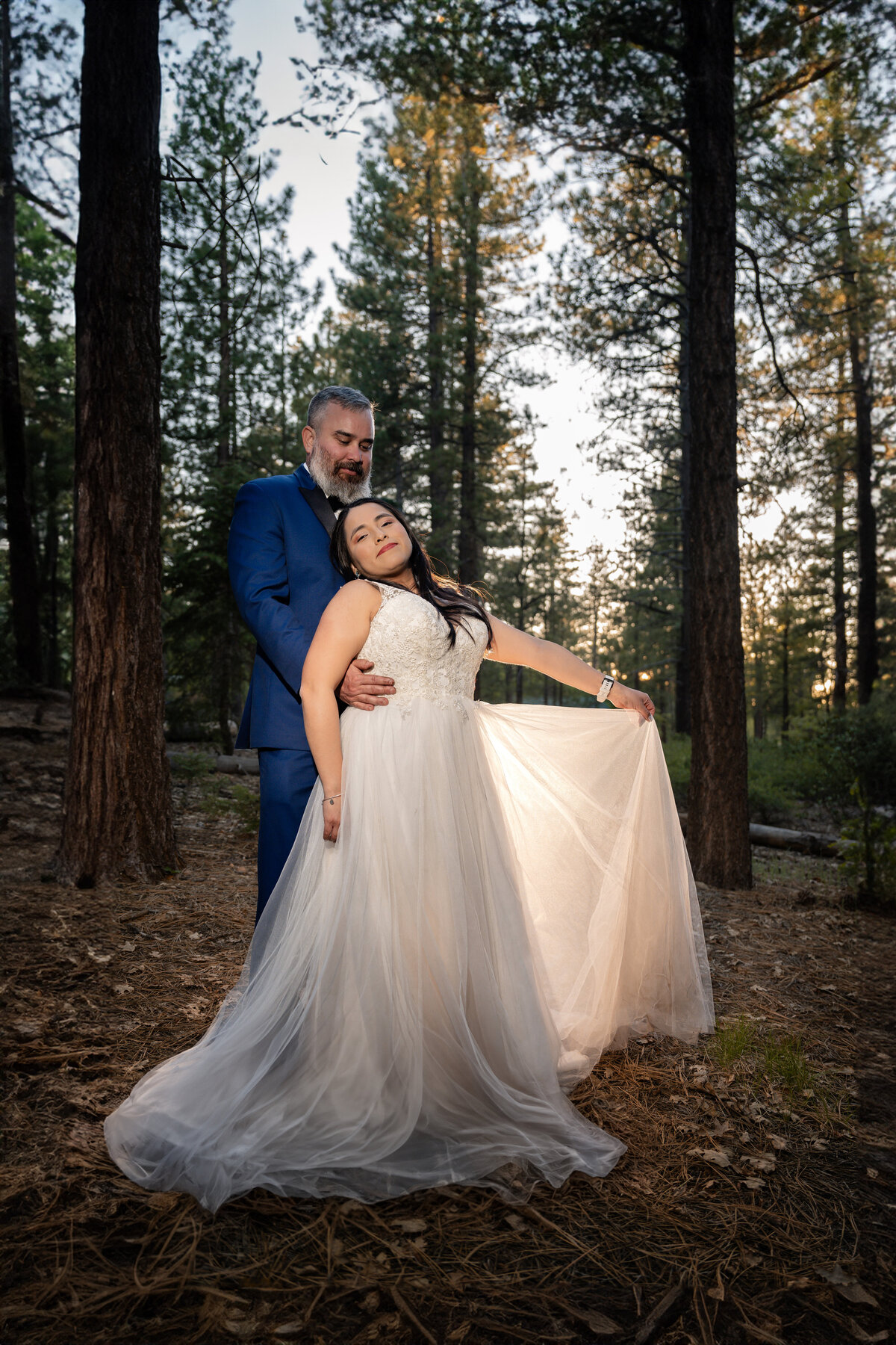 Bride and Groom eloping at Big Bear Buttercup Campground within trees during sunset golden glow.