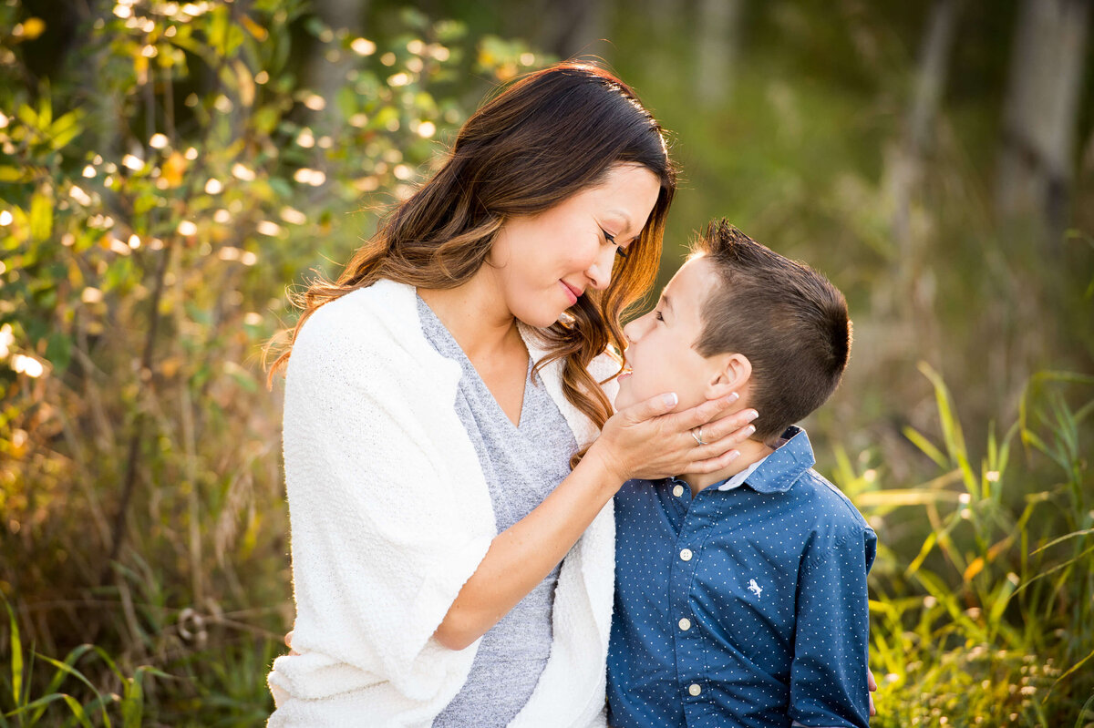a mom hugs her son during their family photography Ottawa