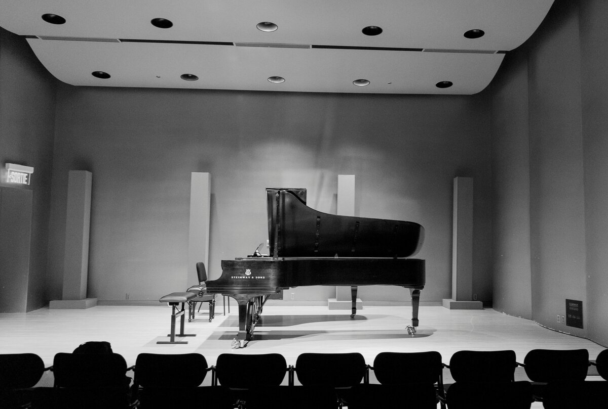 b&w piano on a stage