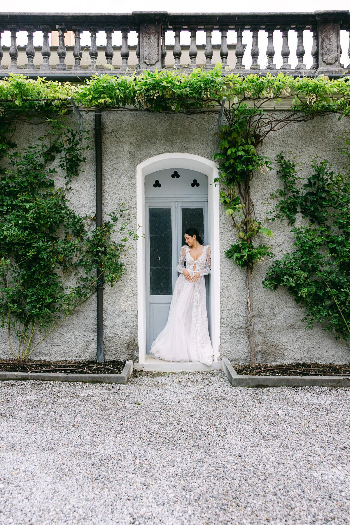 A wedding day bridal shot of a bride in her white dress at Villa Aura del Lago on lake como in Italy