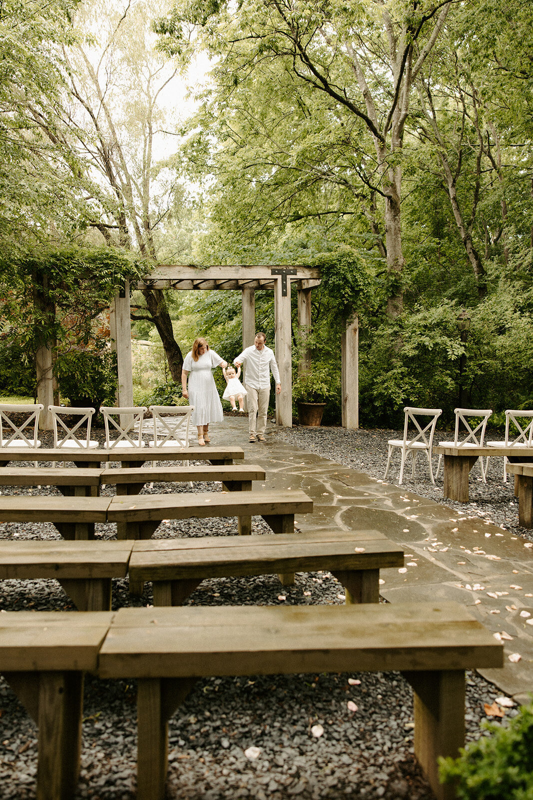 Family walking up the isle at The Mill At Fine Creek during their photoshoot with RVA family photographer
