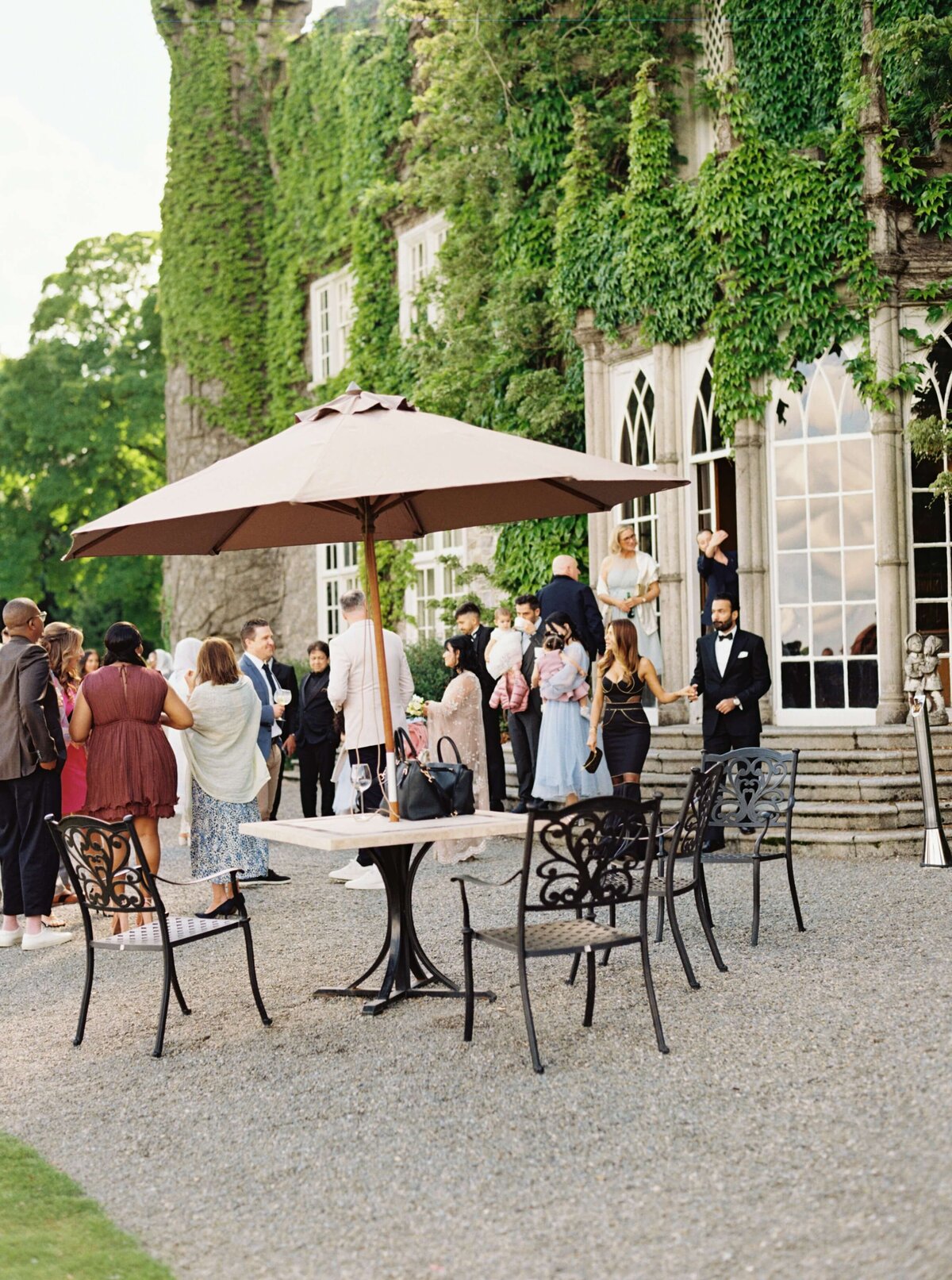 A wedding photo of guests during cocktail hour at Luttrellstown Castle in Ireland