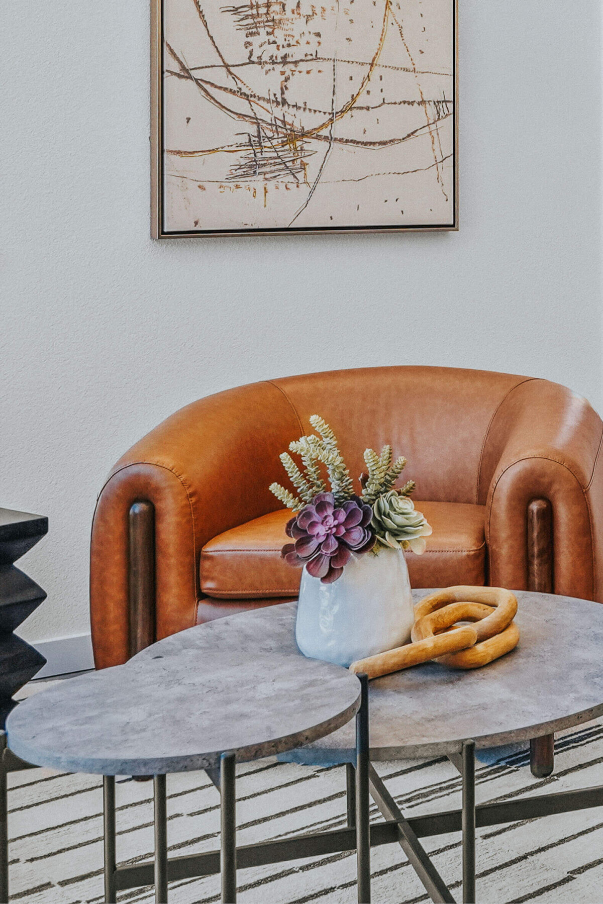 Bright office lobby at Lowden Lane in Redding featuring leather chairs, modern decor, and large windows.