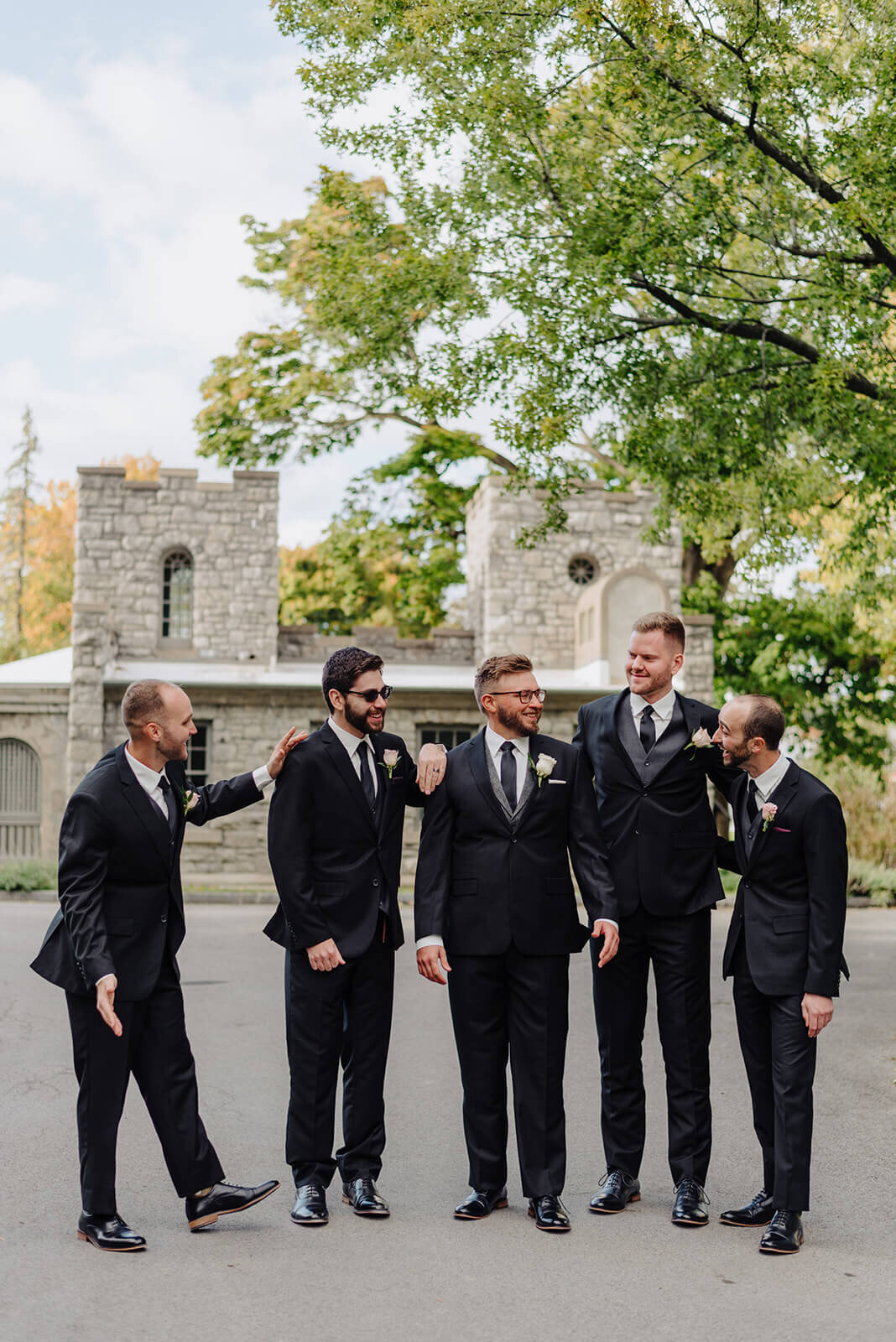 Groom with groomsmen in black suits
