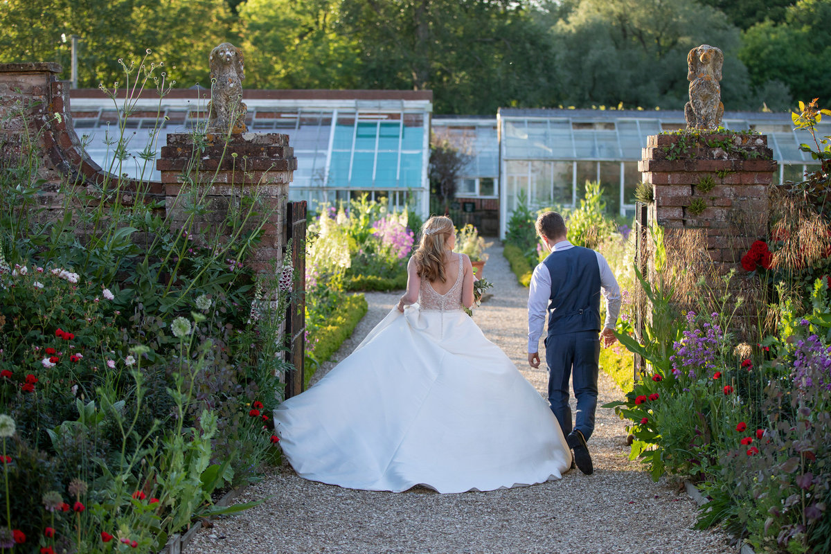 Bride and groom in the veg garden at Forde House Wedding in Somerset_