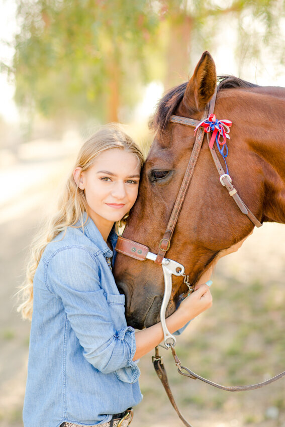 teen girl hugging horse