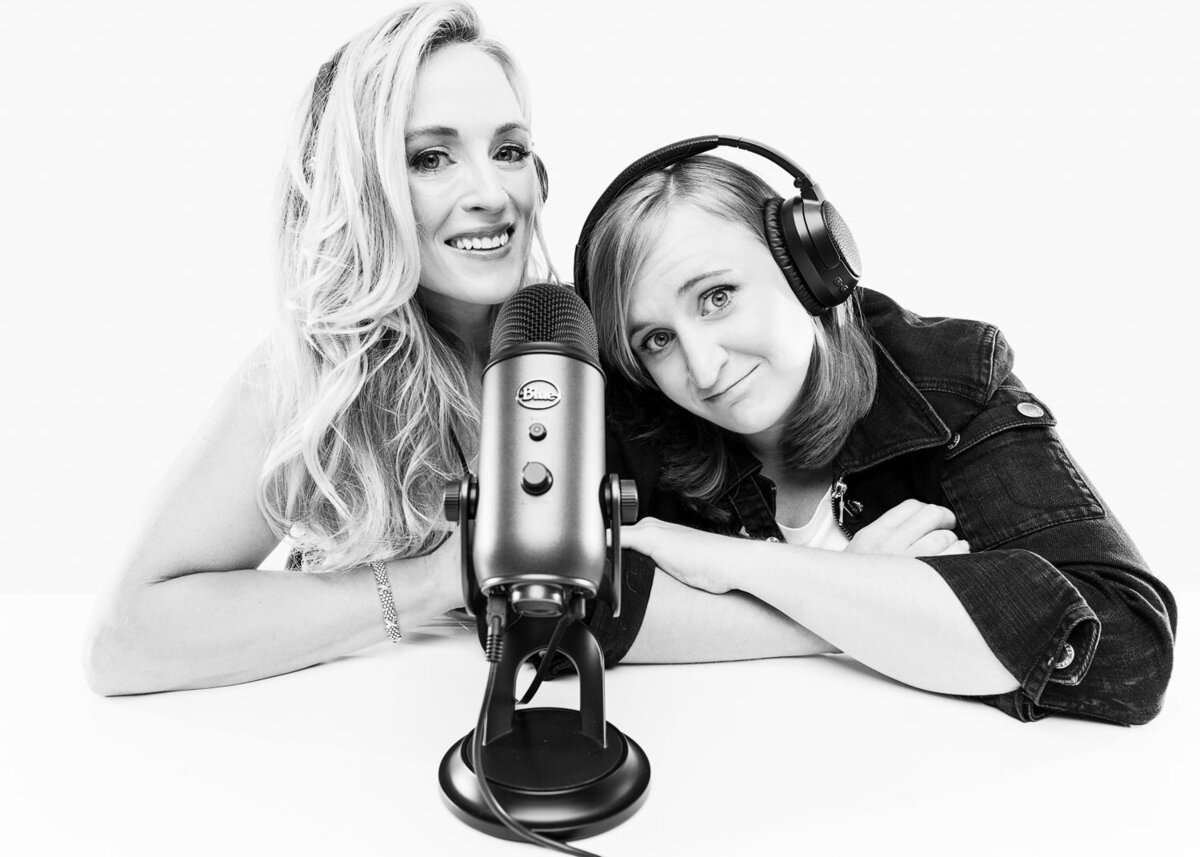 Eat Your Feelings podcasters recording an episode with microphones during a brand-focused portrait session in Austin.
