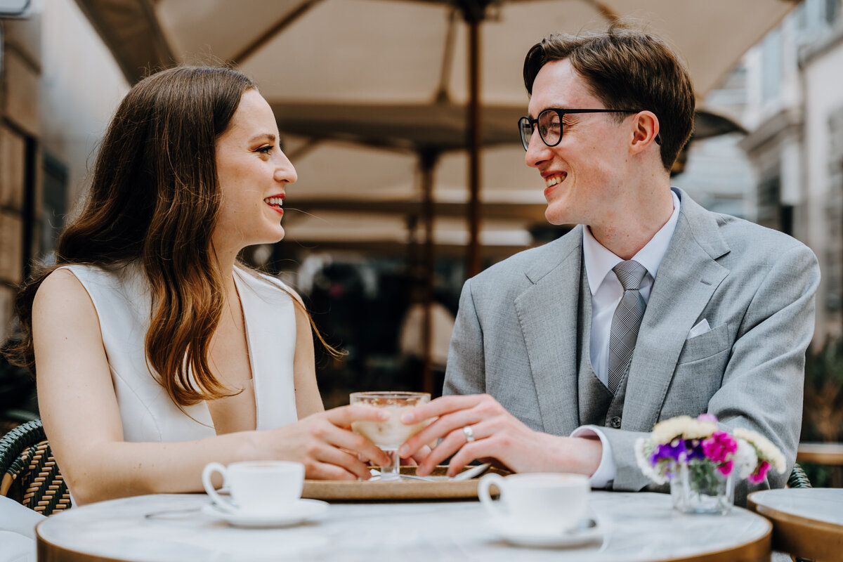 Intimate moment in a narrow Rome alleyway.