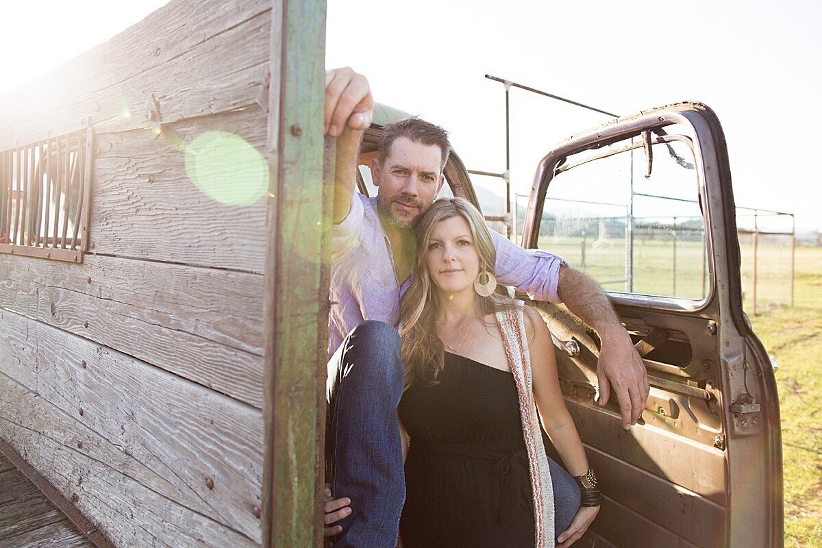 Country couple near old vintage truck on ranch